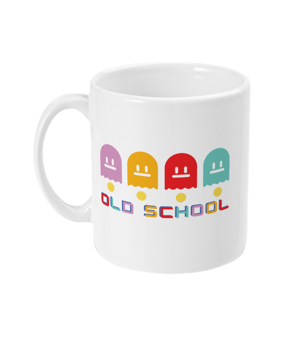 White mug with multicoloured ghost characters , over yellow pac man dots and old school in different colours for each letter