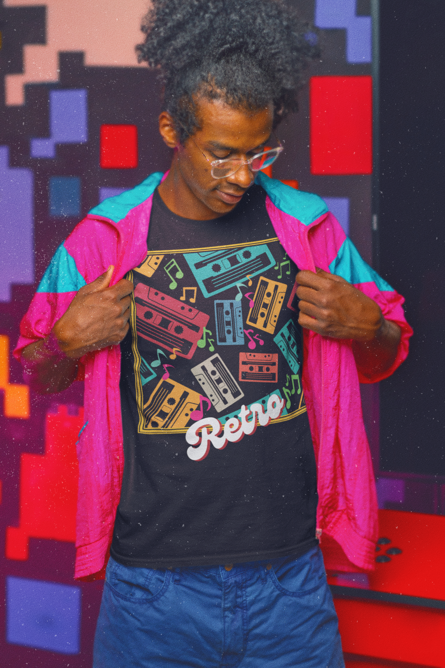 Model wearing black T-Shirt goldish square frame with colourful music notes and cassette tapes spread out at different angles in different colours ,words retro in a retro style at bottom