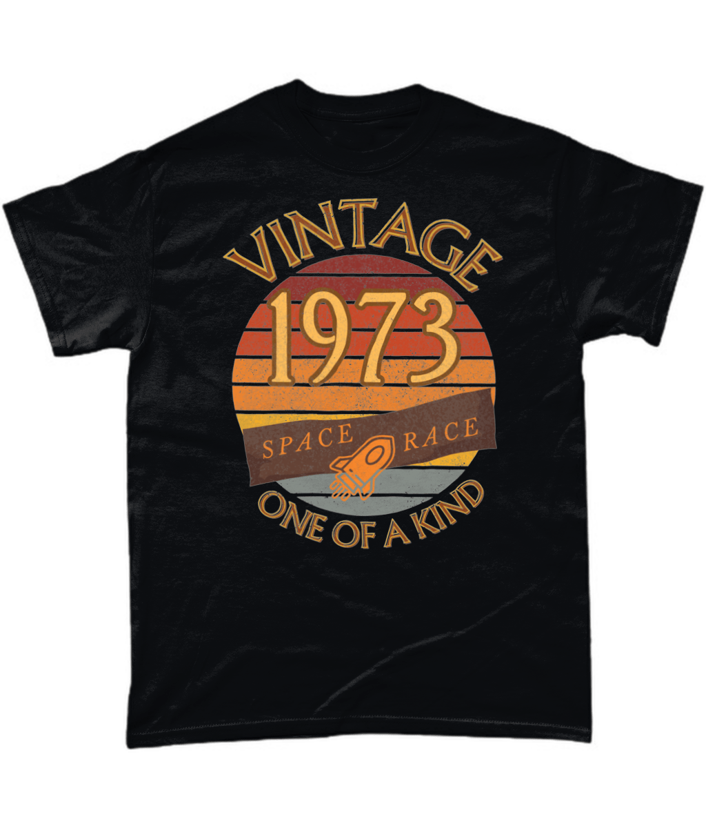 Black T-Shirt with words vintage,1973,space race,one of a kind, image of a simple rocket in front of a brown distressed sunset