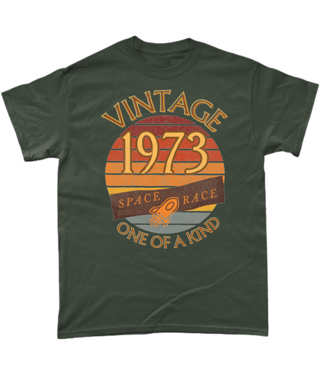 Green T-Shirt with words vintage,1973,space race,one of a kind, image of a simple rocket in front of a brown distressed sunset