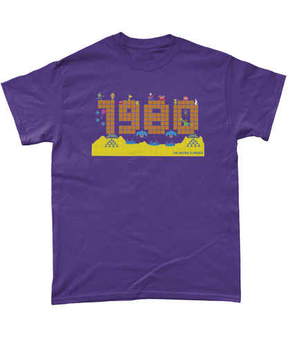 Lilac t shirt with a large 1980 in pixels in orange brown with some notable arcade video gaming sprites from 1980 around it