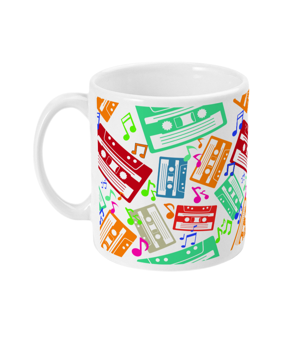 White mug with colourful music notes and cassette tapes spread out at different angles in different colours  around the sides and front.