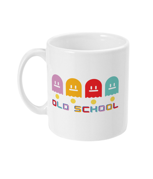 White mug with multicoloured ghost characters , over yellow pac man dots and old school in different colours for each letter  
