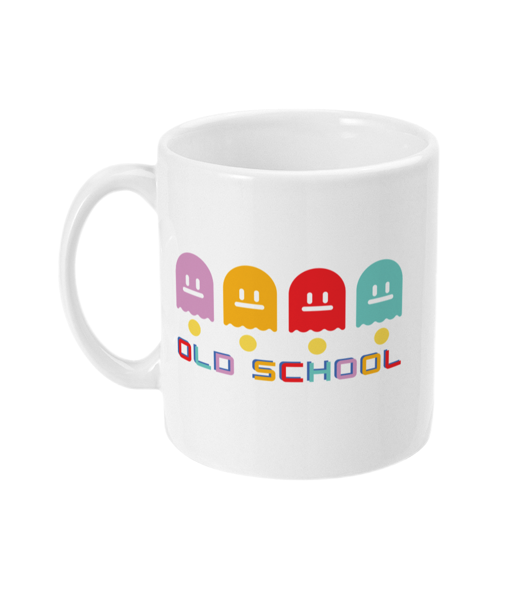 White mug with multicoloured ghost characters , over yellow pac man dots and old school in different colours for each letter  