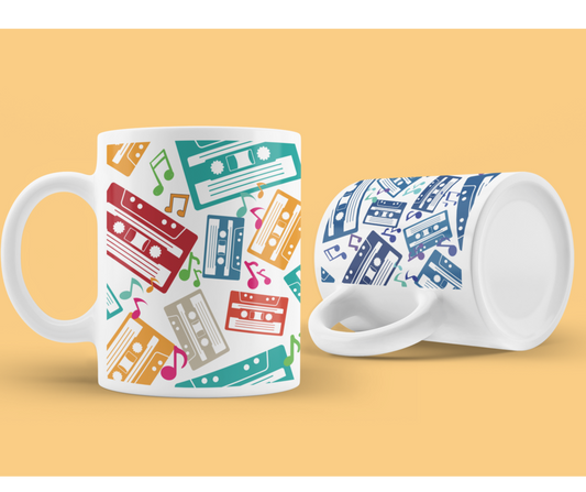 White mug with colourful music notes and cassette tapes spread out at different angles in different colours  around the sides and front.