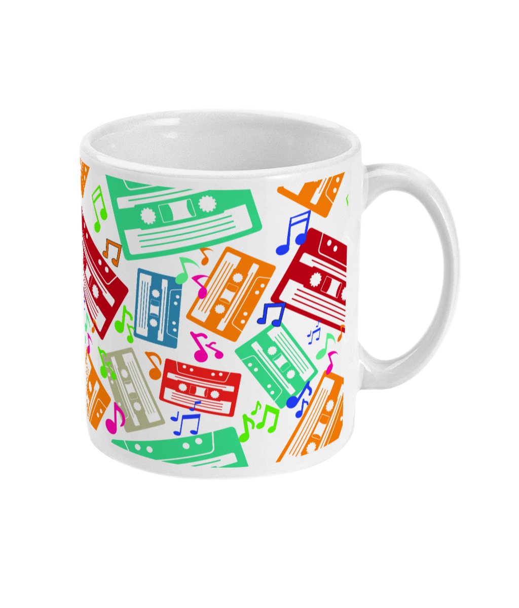 White mug with colourful music notes and cassette tapes spread out at different angles in different colours  around the sides and front.