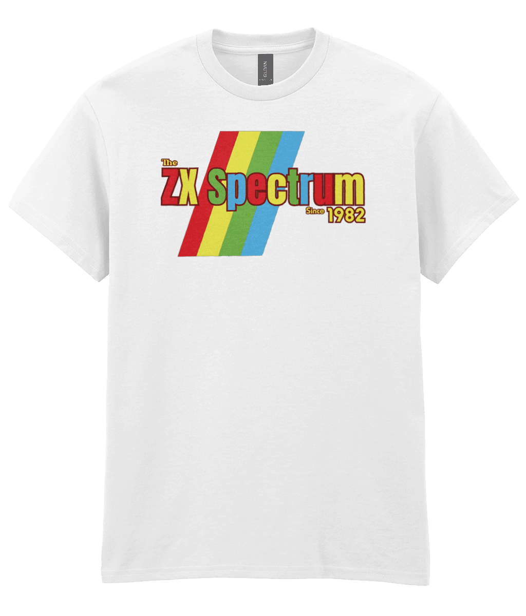 White T-shirt featuring a retro design with the text "The ZX Spectrum" in bold, stylized font. The word "Spectrum" appears in a red-to-yellow gradient, with "Since 1982" in small yellow text below. Four diagonal rainbow stripes—red, yellow, blue, and light blue—run behind the text, referencing the iconic Sinclair ZX Spectrum branding. The shirt pays homage to the 1982 British home computer that sparked playground rivalries and a generation of 8-bit creativity.
