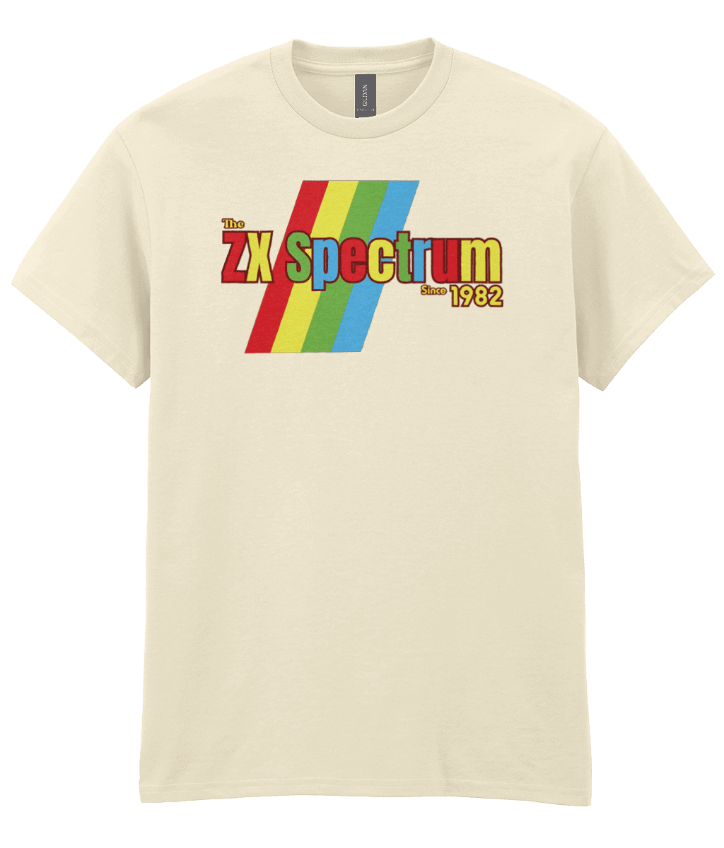 Off white T-shirt featuring a retro design with the text "The ZX Spectrum" in bold, stylized font. The word "Spectrum" appears in a red-to-yellow gradient, with "Since 1982" in small yellow text below. Four diagonal rainbow stripes—red, yellow, blue, and light blue—run behind the text, referencing the iconic Sinclair ZX Spectrum branding. The shirt pays homage to the 1982 British home computer that sparked playground rivalries and a generation of 8-bit creativity.
