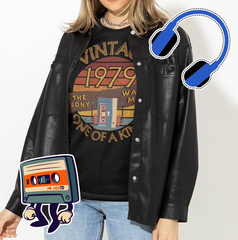 A female wearing a black T-Shirt with words vintage,1979,sony walkman,one of a kind, image of the original TPS-L2 model in front of a brown distressed sunse
