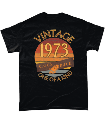 Black T-Shirt with words vintage,1973,space race,one of a kind, image of a simple rocket in front of a brown distressed sunset
