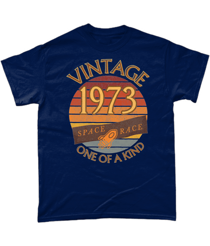 Navy T-Shirt with words vintage,1973,space race,one of a kind, image of a simple rocket in front of a brown distressed sunset