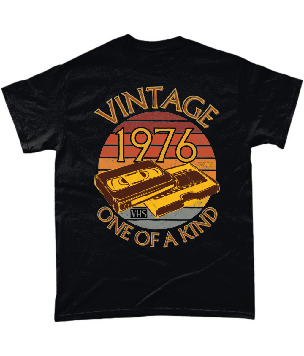 Black T-Shirt with words vintage,1976,japan,one of a kind, image of a simple VHS tape in front of a brown distressed sunset