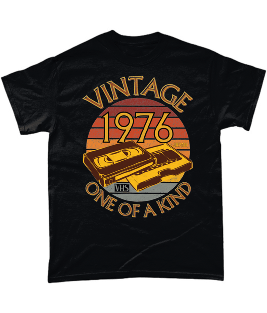 Black T-Shirt with words vintage,1976,japan,one of a kind, image of a simple VHS tape in front of a brown distressed sunset