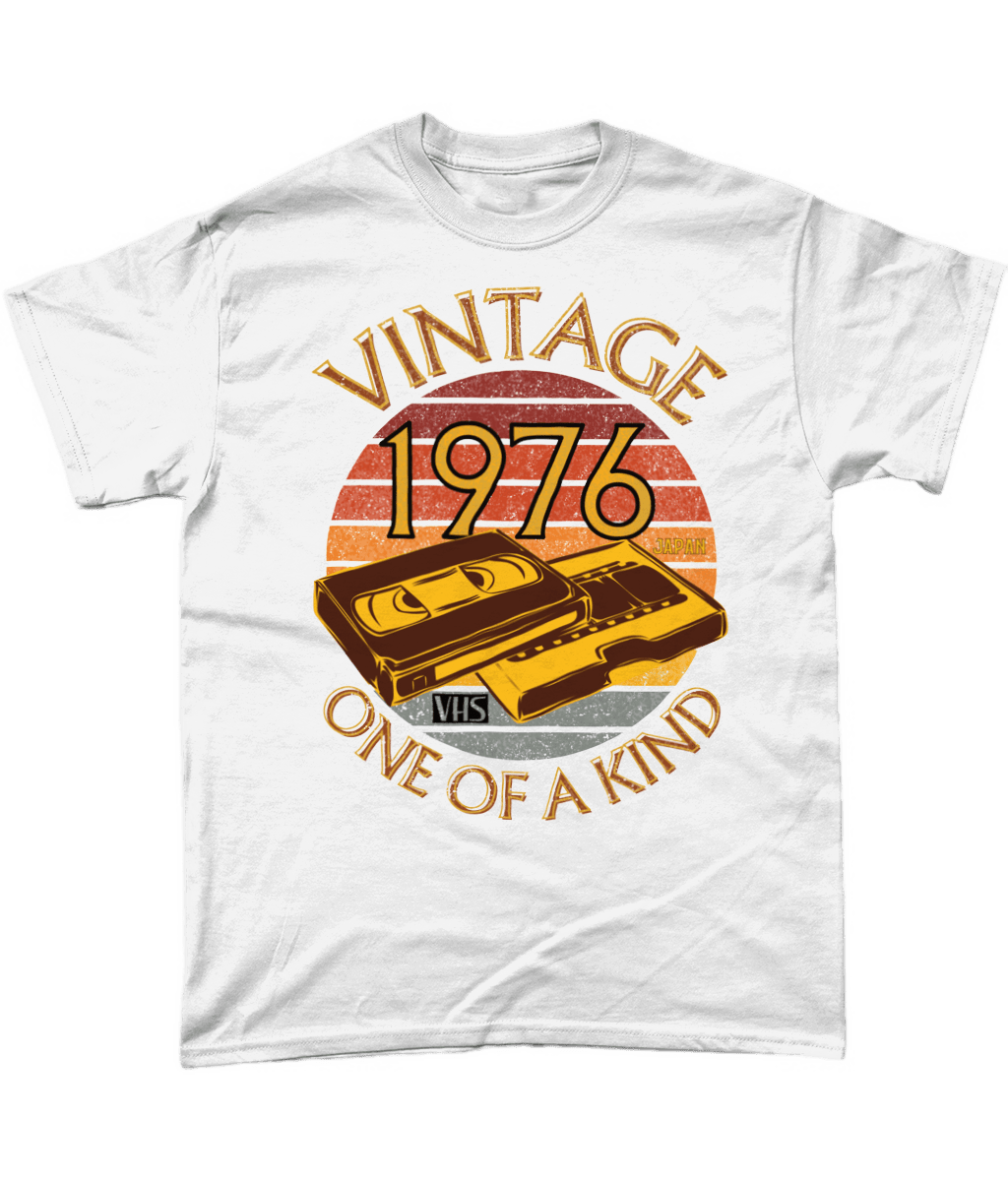 White T-Shirt with words vintage,1976,japan,one of a kind, image of a simple VHS tape in front of a brown distressed sunset