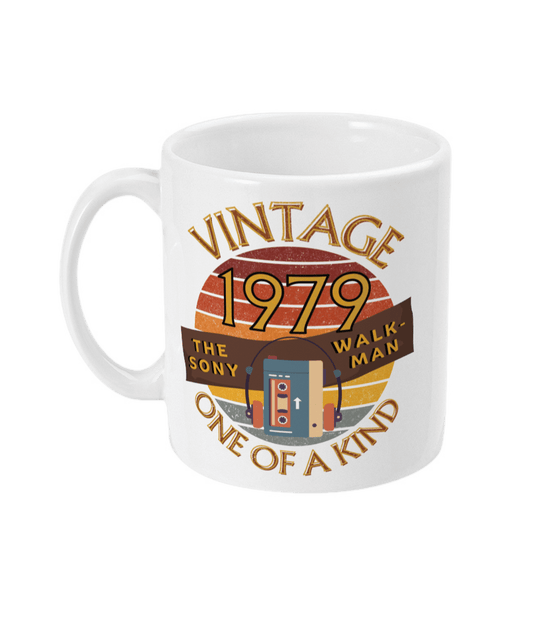 White mug  with words vintage,1979,the sony walkman,one of a kind, image of the original TPS-L2 model in front of a brown distressed sunset