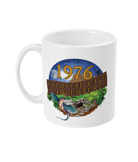 White mug with words,1976,colossal cave adventure,circular picture of a dragon,cave and woodland,night sky
