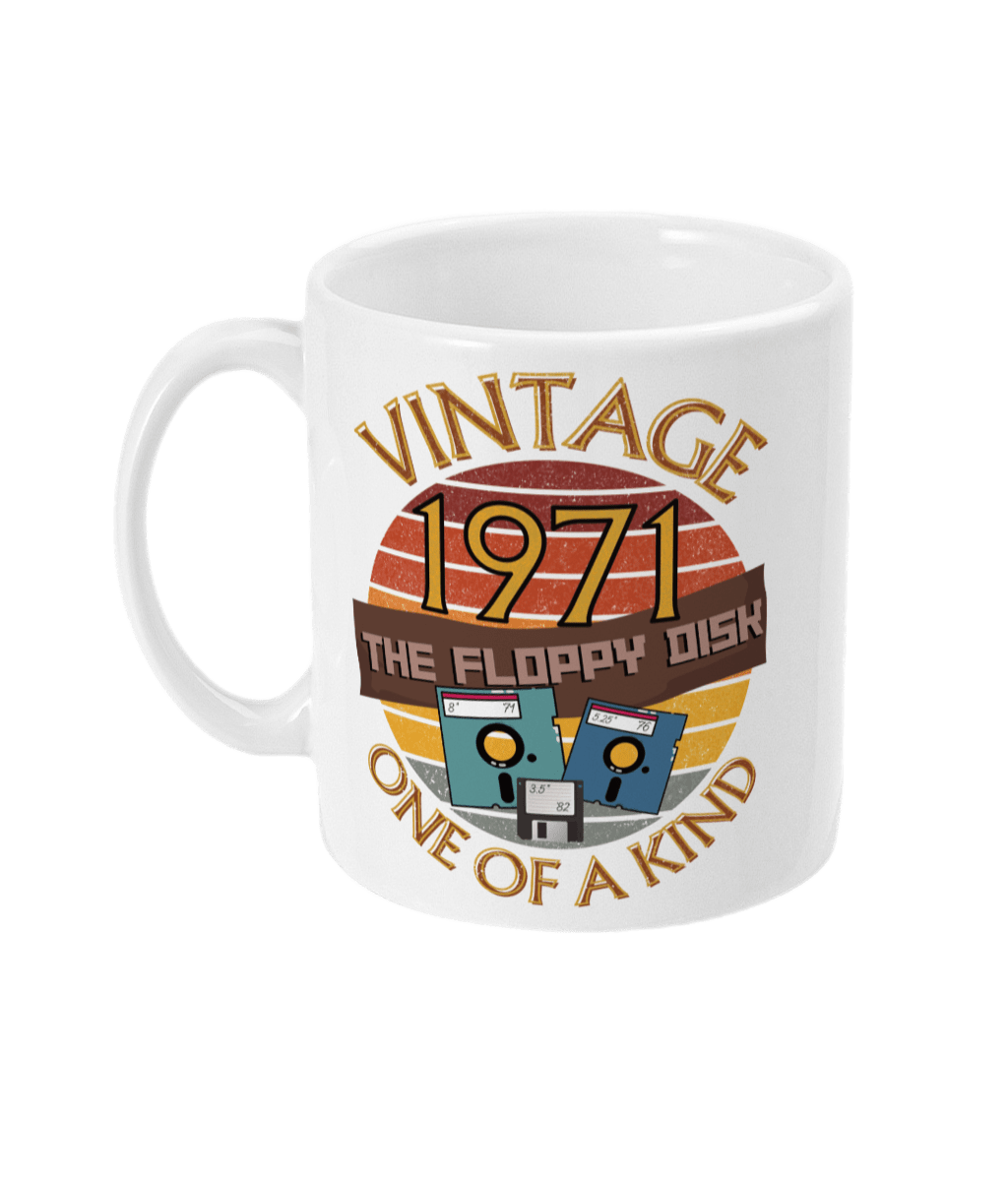 White mug with the words vintage,1971,the floppy disk ,one of a kind, 3 different types of floppy disk,8,5.25,3.5 inch